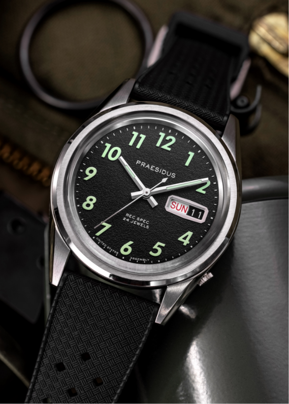 A-11 Tom Rice black dial watch on a rubber strap
