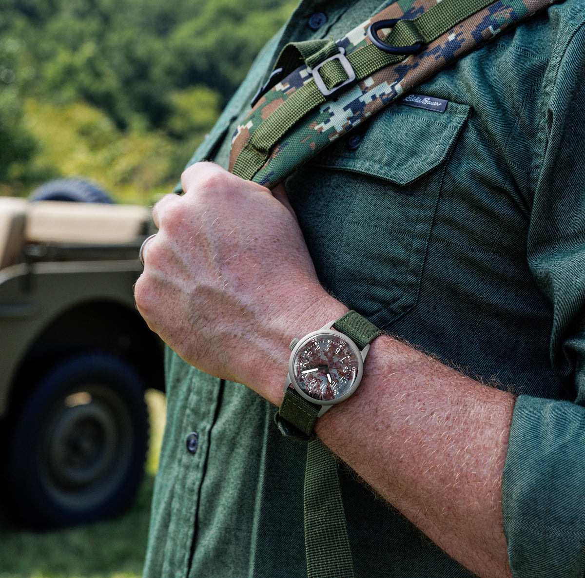 A-11 LMUV watch worn on the wrist with a field jacket