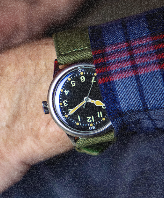 A-11 Vince Speranza watch on a green strap, worn on the wrist
