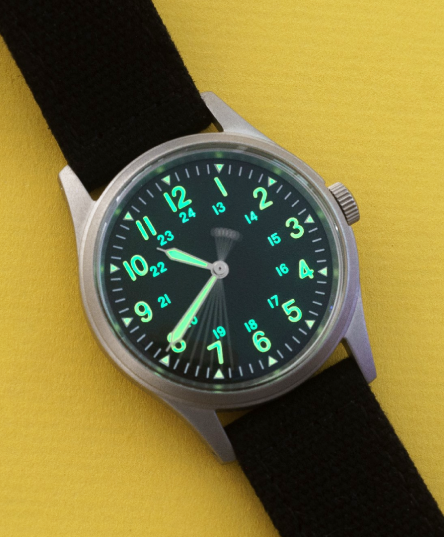 Jungle Field watch with green luminous dial on a black strap